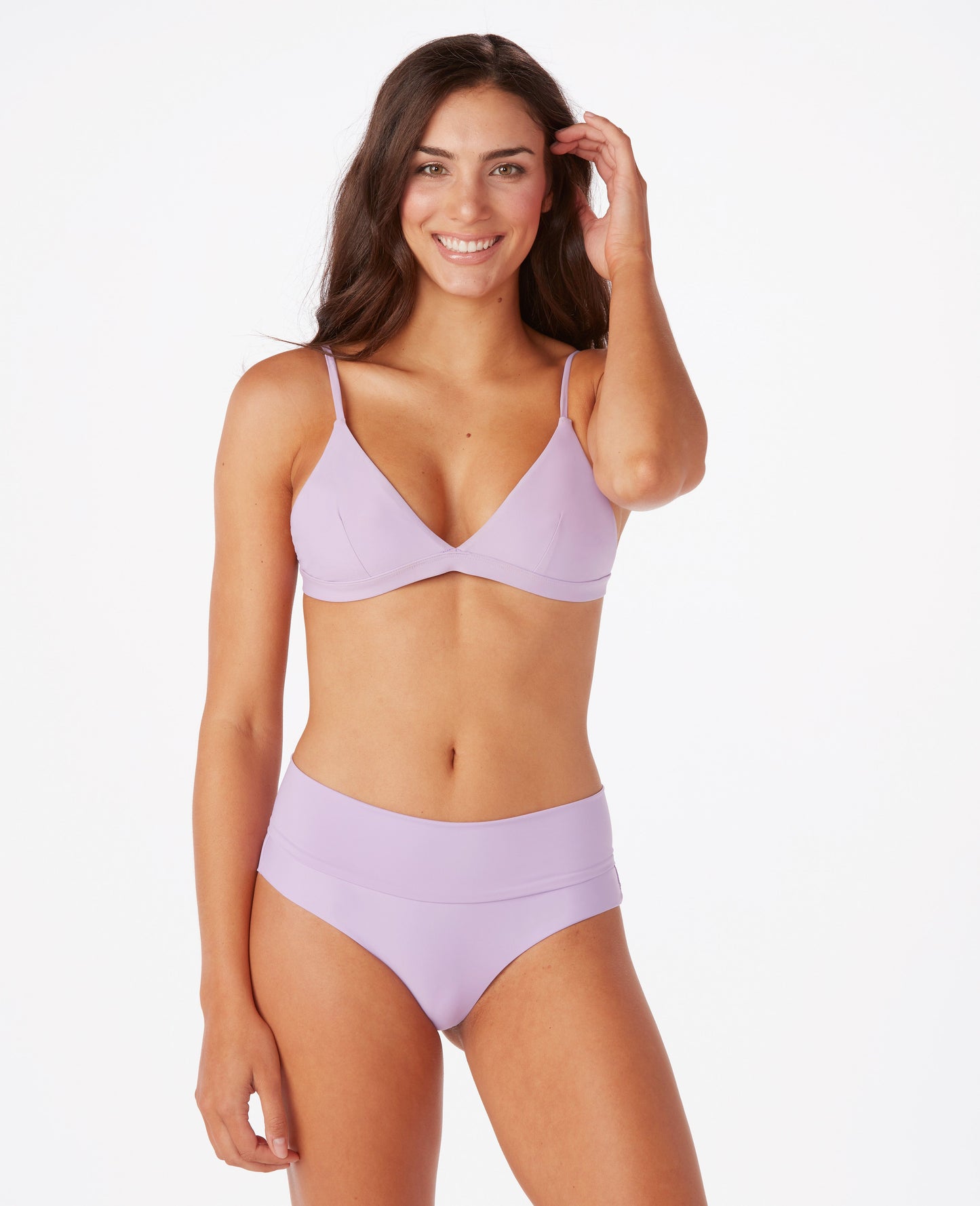 Woman in lavender bikini against white background.