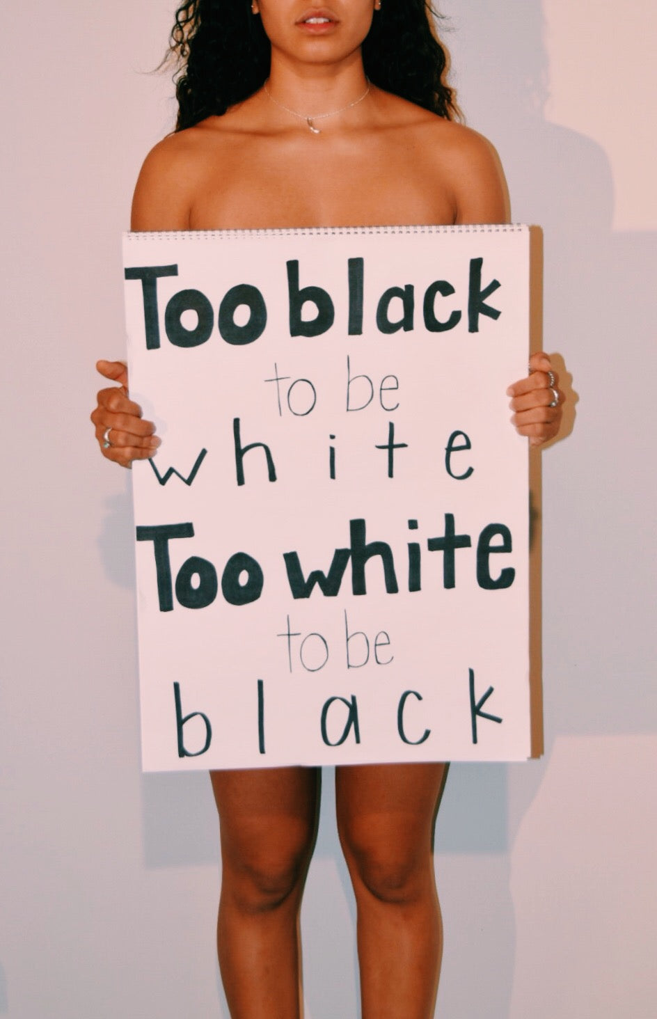 Too Black to be White. Too White to be Black.