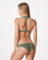 Back of a woman in a sage colored bikini. Bikini top has a T-strap back and bottom has a hipster cut.